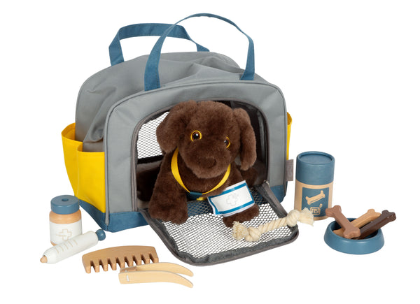 Labrador-Hund mit Tasche und Pflege-Set