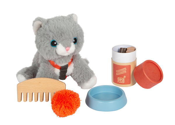 Katze mit Tasche und Pflege-Set