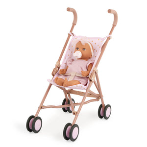 Babypuppe mit Schnuller im Kleid mit Stirnband
