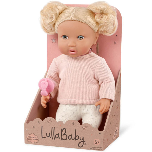 Babypuppe mit Haaren und Schnuller, in einem zweiteiligen Outfit