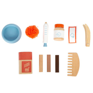 Katze mit Tasche und Pflege-Set