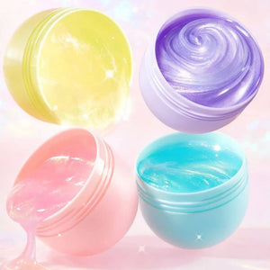 Vier geöffnete Dosen Pearly Putty in Gelb, Lila, Rosa und Türkis