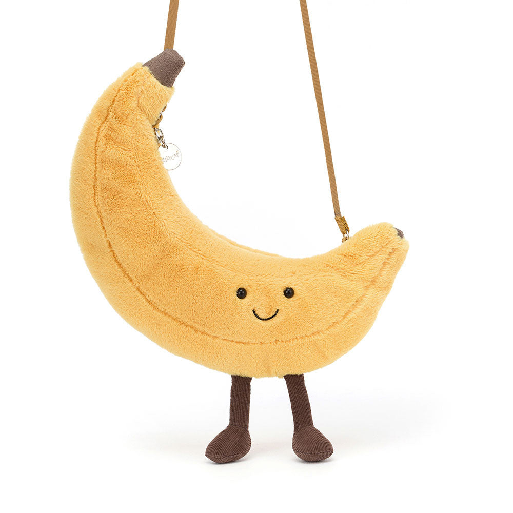 Jellycat Plüsch-Umhängetasche Fröhliche Banane 22 cm in Gelb mit Gesicht und braunen Füßen